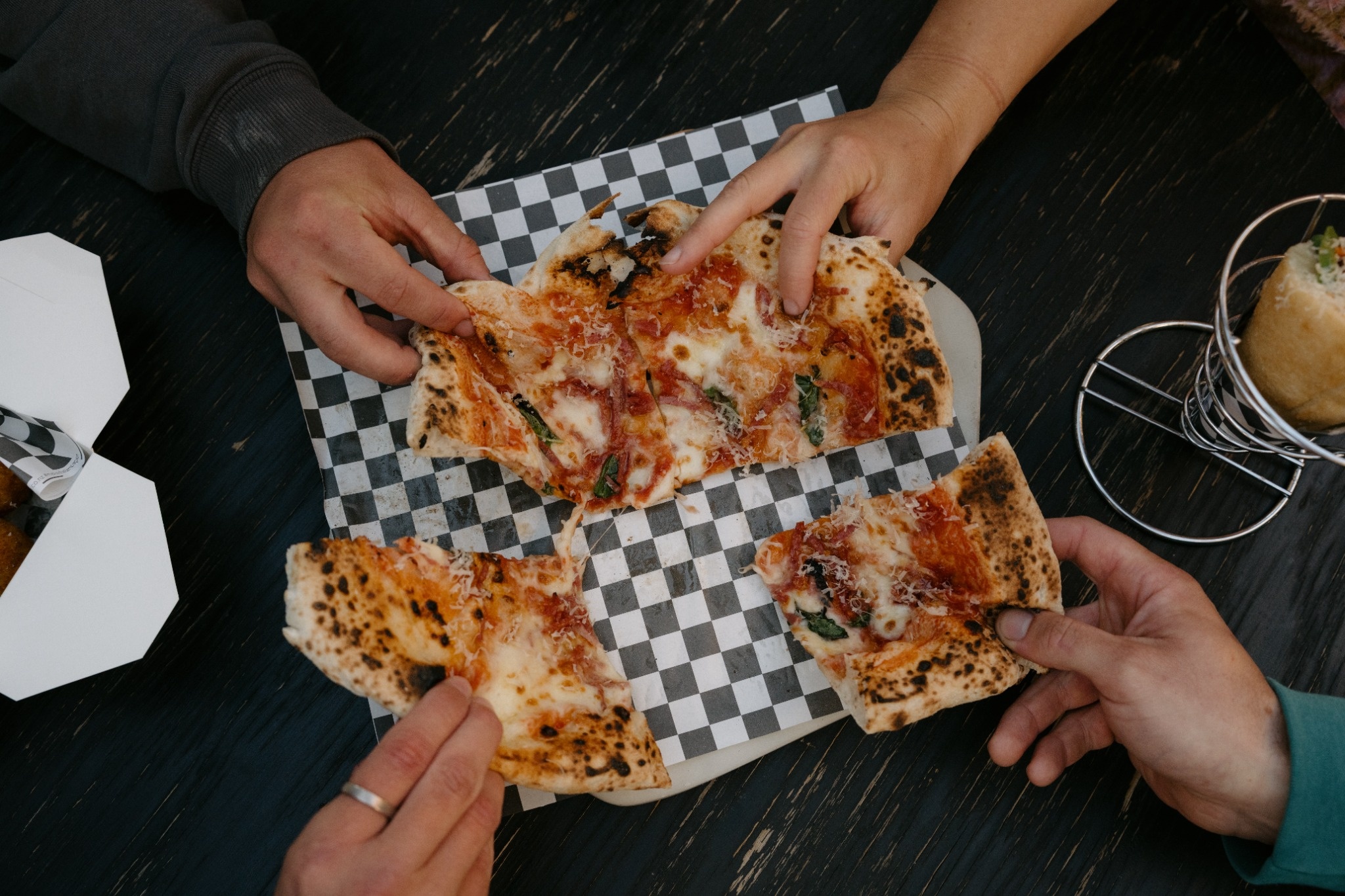 People sharing pizza